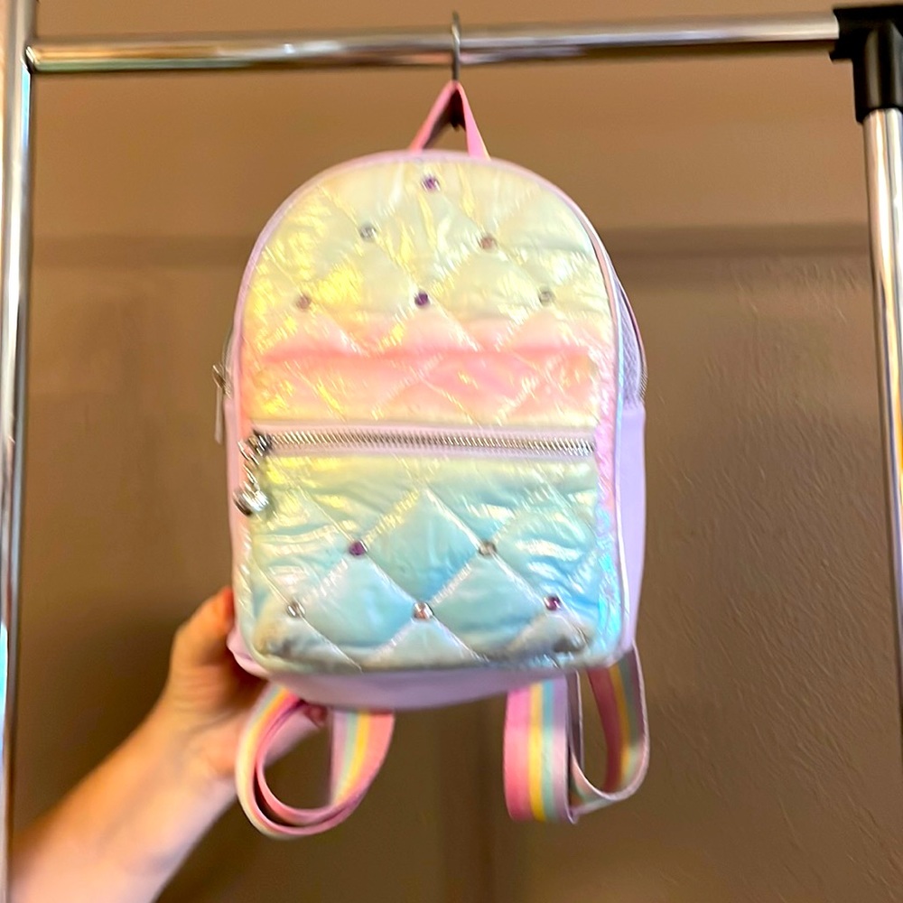Smaller backpack rainbow. No stains or tears. Very cute.
